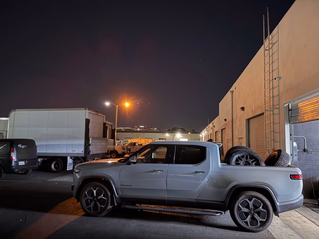 Rivian R1T hauling Cybertruck wheels and tires