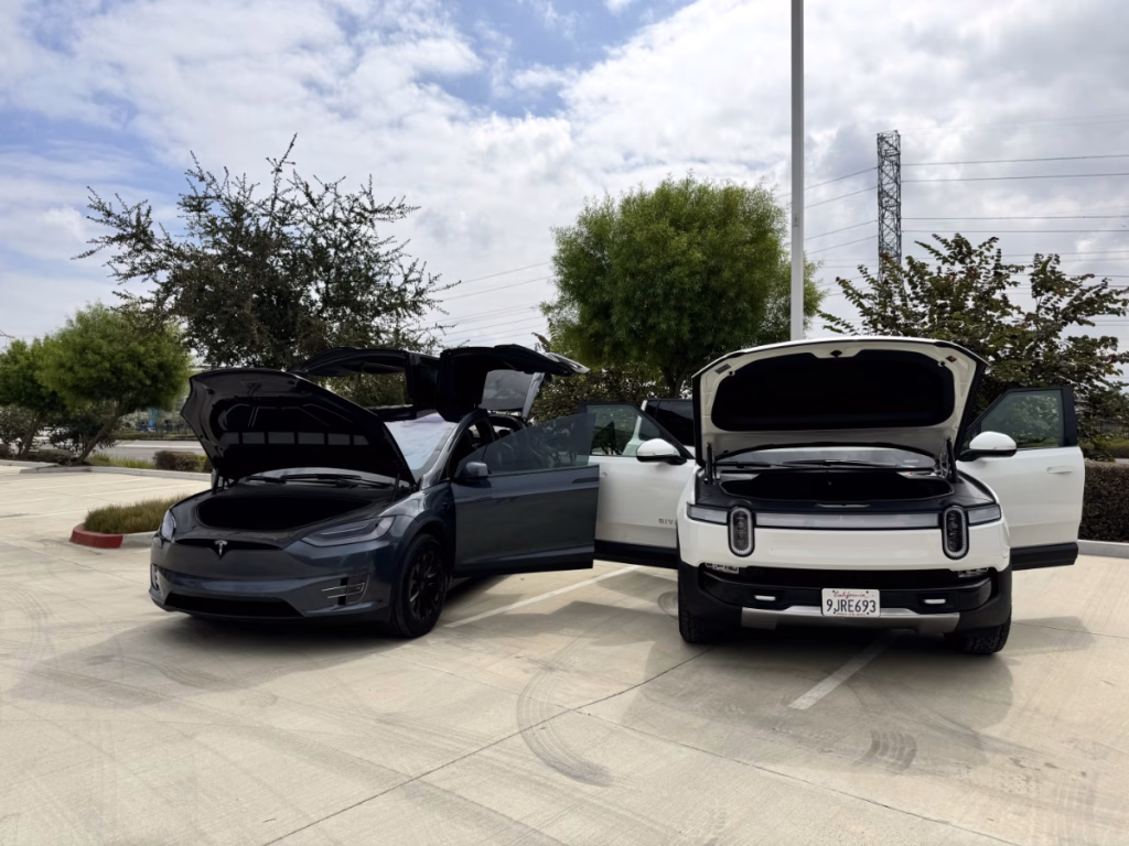 Model X next to Rivian R1S