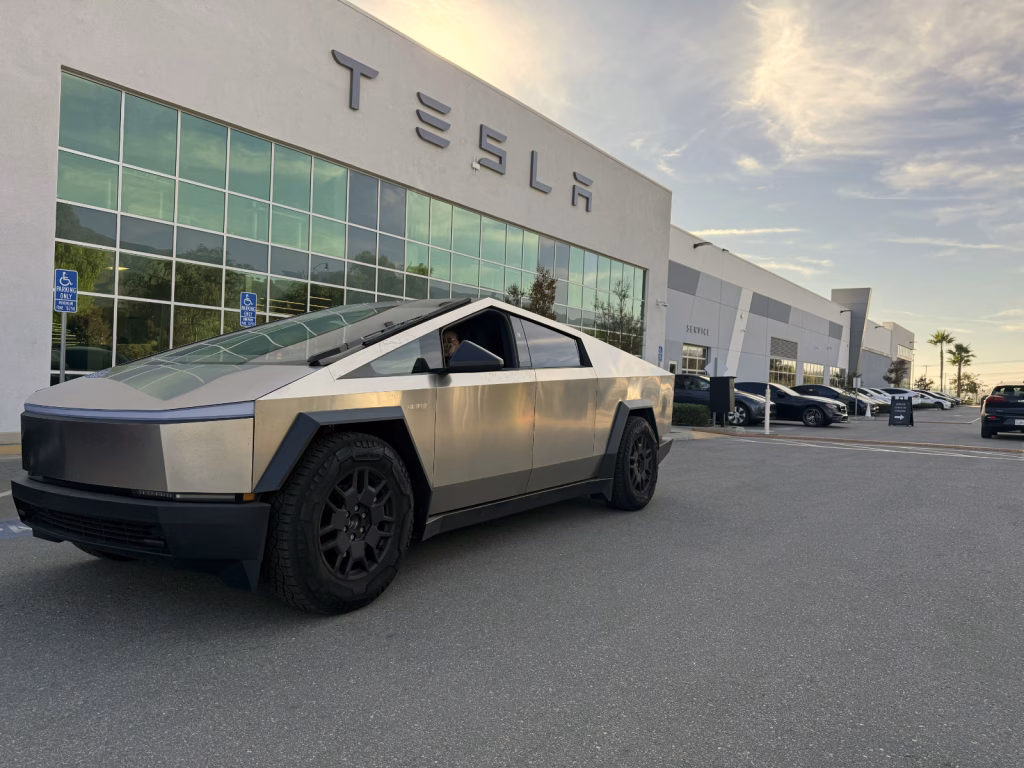 Cybertruck parked in front of Tesla