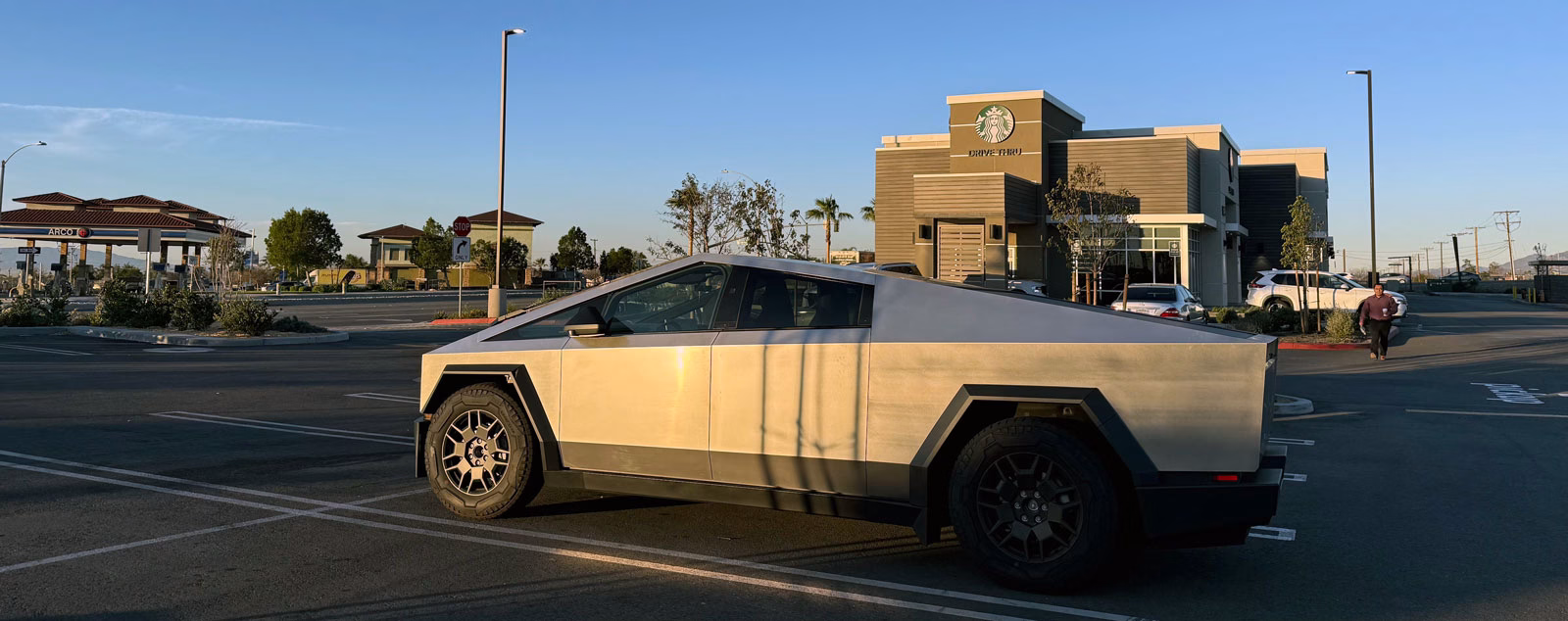 Cybertruck parked in front of Starbucks