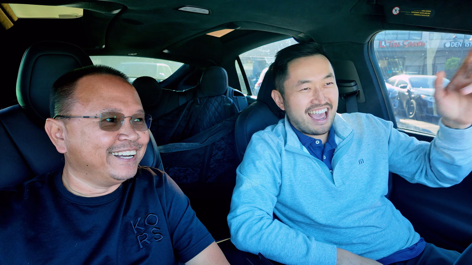 Two guys inside Model X talking about cars